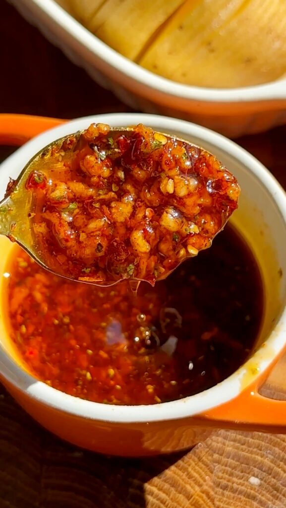 In a small bowl, whisk together olive oil, minced garlic, chili flakes, Italian herbs, smoked paprika, salt, and pepper. 