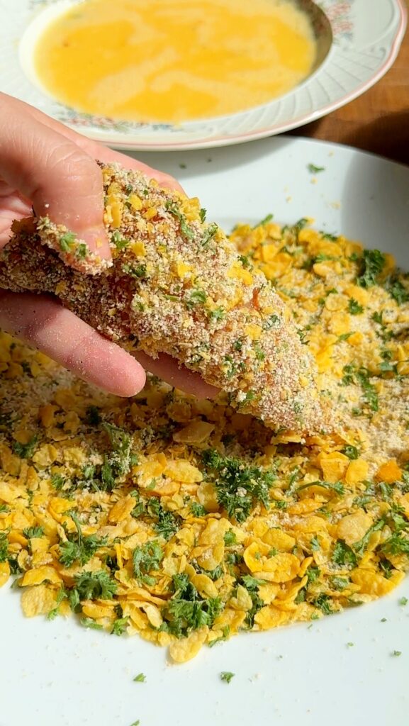 roll the chicken in the breadcrumb mixture