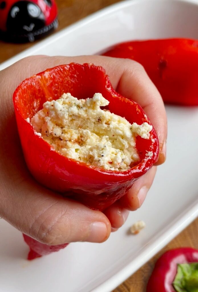 Stuff the Peppers
Use a teaspoon to carefully fill each pepper with the feta mixture.
Leave some space at the top to avoid overfilling.