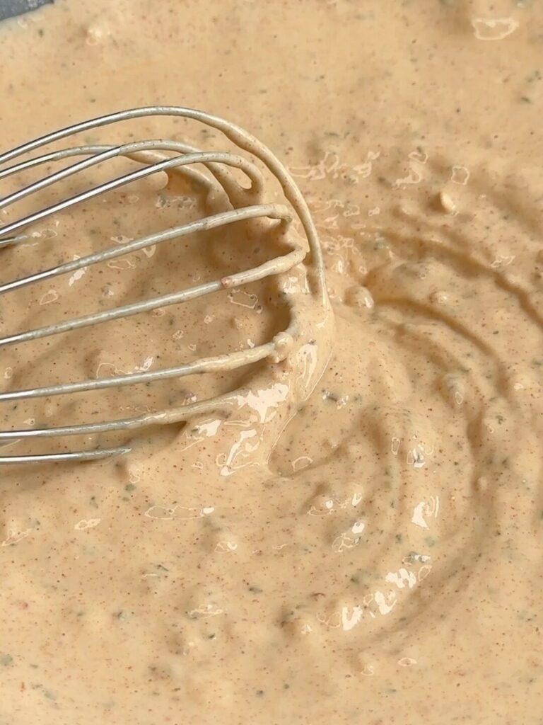 The Greek yoghurt, egg, flour, and spices mixed together into a smooth, creamy coating for Cornflake Crusted Chicken Schnitzel