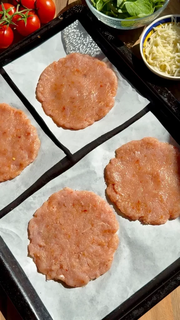 Preparing chicken discs evenly sized for baked stuffed pockets